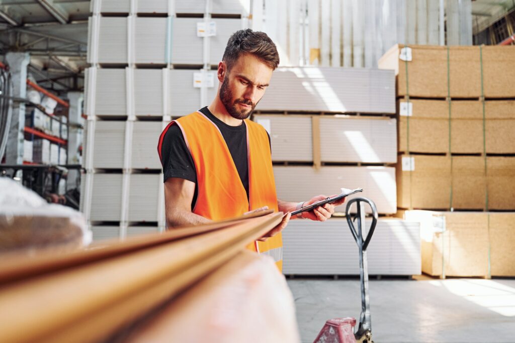 Checking quality of product. Storage worker is in the warehouse